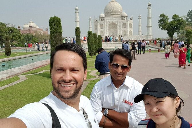 Taj Mahal & Agra Fort Car Tour from Delhi with 5</em> Meals – Itimad-ud-Daulah (Baby Taj) in 30 minutes: smaller, still worth it’ /><br />
After lunch, you go to <strong>Itimad-ud-Daulah</strong>, often called the <strong>Baby Taj</strong>. Your guided time here is about <strong>30 minutes</strong>, and entry is included.</p>
<p><p>This is the “finishing touch” stop. It’s not as large as the Taj Mahal, so it can be tempting to think it’s optional. But when you’ve already seen the big monument, Baby Taj becomes a study in refinement—something you appreciate more if you’re not exhausted.</p>
</p>
<p><p>This short timing window is actually a benefit. It keeps the day from dragging while still letting you:</p>
</p>
<ul>
<li>see the guided highlights,</li>
<li>take your own photos,</li>
<li>and close the tour with a calmer moment after the fort.</li>
</ul>
<p><p>If you want the best experience here, slow down for the key details your guide points out. Baby Taj rewards careful looking, and 30 minutes is enough when you stay focused.</p>
</p>
<h2 id="what-your-guide-and-driver-quality-usually-means-for-you">What your guide and driver quality usually means for you</h2>
<p>A theme across the best days on this tour is that the guide does two things well: explains what you’re seeing and helps you get the photo moments without chaos. In this experience, guide names like <strong>Kamran</strong>, <strong>Rashid</strong>, <strong>Owais</strong>, <strong>Shaan</strong>, <strong>Amir</strong>, <strong>Zuber</strong>, <strong>Naresh</strong>, <strong>Shuaib</strong>, <strong>Rahul</strong>, and <strong>Sanjay</strong> show up in the strongest outcomes tied to clear storytelling and patient pacing.</p>
<p><p>I can’t promise which guide you’ll get, but you can increase your odds of a smooth day by doing two simple things:</p>
</p>
<ul>
<li>Ask what you should focus on first at the Taj so you don’t waste time deciding.</li>
<li>Tell your guide if you want more photo time or more explanations, then follow their suggested route.</li>
</ul>
<p><p>For the driver side, the best feedback pairs often mention safe, efficient driving and punctual pickup. That’s huge on a day that’s only 12 hours long and has early-morning timing options.</p>
</p>
<p><p>Also bring a <strong>valid photo ID</strong>—you’ll need it for monument checking.</p>
</p>
<h2 id="timing-tips-sunrise-works-friday-changes-everything">Timing tips: sunrise works, Friday changes everything</h2>
<p>If you can handle an early start, sunrise is usually the best move for the Taj Mahal. You’ll arrive closer to opening time, which helps you beat the densest crowds. The marble also changes color as the light shifts, so the earlier you go, the more you benefit from that effect.</p>
<p><p>If your travel dates include <strong>Friday</strong>, you’ll need a plan because the Taj Mahal is closed. You can still do the tour, but don’t count on a Taj visit that day.</p>
</p>
<p><p>If you don’t want sunrise, choose a later departure. You’ll spend more of the day in traffic and heat, but you’ll likely enjoy the monuments at a more comfortable pace. Either way, drink water and take your time inside.</p>
</p>
<h2 id="should-you-book-this-taj-mahal-and-agra-fort-car-tour">Should you book this Taj Mahal and Agra Fort car tour?</h2>
<p>Book it if:</p>
<ul>
<li>You want a <strong>private</strong> day with pickup from your area and an air-conditioned car.</li>
<li>You care about getting into the Taj Mahal without ticket-line stress.</li>
<li>You want a break that’s more than a roadside snack—<strong>a 5-star buffet meal</strong> at DoubleTree makes a big difference on a long day.</li>
<li>You like the idea of finishing with <strong>Baby Taj</strong> rather than stopping after the big one.</li>
</ul>
<p><p>Skip it (or adjust expectations) if:</p>
</p>
<ul>
<li>You strongly dislike early mornings or long transit days. This is a 12-hour loop with about 3 hours each way.</li>
<li>Your dates include <strong>Friday</strong> and Taj Mahal is the only thing you came for.</li>
<li>You’re traveling super budget-tight for drinks, since lunch includes food but drinks are not included.</li>
</ul>
<p><p>If you’re on your first trip to Agra, this layout is a solid use of time: Taj Mahal first, then Agra Fort, then Itimad-ud-Daulah, with the comfort and structure you need to enjoy it instead of just racing through.</p>
</p>
<h2 id="faq">FAQ</h2>
<h3 id="how-long-is-the-tour-from-delhi-to-agra">How long is the tour from Delhi to Agra?</h3>
<p>It runs for about <strong>12 hours</strong> (approx.), including the drive time from Delhi to Agra and back, plus visits and the meal stop.</p>
<h3 id="what-sites-are-included-in-agra">What sites are included in Agra?</h3>
<p>You’ll visit the <strong>Taj Mahal</strong>, <strong>Agra Fort</strong>, and <strong>Itmad-ud-Daulah (Baby Taj)</strong>, with guided time at each stop.</p>
<h3 id="are-monument-entry-fees-included">Are monument entry fees included?</h3>
<p>Yes, entry is included if you choose the option that includes <strong>monument tickets</strong>. There is also an option to include entry fees.</p>
<h3 id="is-the-meal-included">Is the meal included?</h3>
<p>The meal is included if you select the option that includes a meal. The stop is at <strong>DoubleTree by Hilton Hotel Agra</strong> for a buffet breakfast or lunch.</p>
<h3 id="do-i-need-to-stand-in-line-for-tickets">Do I need to stand in line for tickets?</h3>
<p>Your guide provides your entry passes and tickets for the Taj Mahal and Agra Fort so you can avoid ticket lines.</p>
<h3 id="what-areas-in-the-delhi-region-can-they-pick-up-from">What areas in the Delhi region can they pick up from?</h3>
<p>Pickup is offered from <strong>Delhi, Noida, Gurugram, Ghaziabad, and Faridabad</strong>, and also drop-off anywhere in those areas.</p>
<h3 id="what-car-will-we-ride-in">What car will we ride in?</h3>
<p>Car type depends on your group size: a four-seater sedan (1–2 people), six-seater wagon (3–5), nine-seater van (6–9), or twelve-seater van (10–12).</p>
<h3 id="is-the-taj-mahal-open-every-day">Is the Taj Mahal open every day?</h3>
<p>No. The <strong>Taj Mahal is closed every Friday</strong>.</p>
<h3 id="what-id-do-i-need-for-entry">What ID do I need for entry?</h3>
<p>Bring a <strong>valid photo ID</strong> for monument checking.</p>
<h3 id="can-i-cancel-and-get-a-full-refund">Can I cancel and get a full refund?</h3>
<p>Yes. You can cancel up to <strong>24 hours in advance</strong> for a full refund. Canceling less than 24 hours before the start time is not refunded.</p>
<div class="sb-related-posts"><h3>You Might Also Enjoy</h3><div class="sb-related-grid"><a href="https://thenewdelhiguide.com/private-5-days-golden-triangle-tour-delhi-agra-jaipur/" class="sb-related-item"><img decoding="async" width="300" height="200" src="https://l.thenewdelhiguide.com/wp-content/uploads/private-5-days-golden-triangle-tour-delhi-agra-jaipur-400x267.jpg" class="attachment-medium size-medium wp-post-image" alt="Private 5 Days Golden Triangle Tour ( Delhi - Agra - Jaipur ) - Day 1 in Delhi: Old Delhi sights plus grand monuments" loading="lazy" srcset="https://l.thenewdelhiguide.com/wp-content/uploads/private-5-days-golden-triangle-tour-delhi-agra-jaipur-400x267.jpg 400w, https://l.thenewdelhiguide.com/wp-content/uploads/private-5-days-golden-triangle-tour-delhi-agra-jaipur.jpg 669w" sizes="auto, (max-width: 300px) 100vw, 300px" /><span>Private 5 Days Golden Triangle Tour ( Delhi – Agra – Jaipur )</span></a><a href="https://thenewdelhiguide.com/private-delhi-city-tour-old-delhi-new-delhi-and-major-attraction/" class="sb-related-item"><img decoding="async" width="300" height="200" src="https://l.thenewdelhiguide.com/wp-content/uploads/private-delhi-city-tour-old-delhi-new-delhi-and-major-attraction-400x267.jpg" class="attachment-medium size-medium wp-post-image" alt="Private Delhi City Tour-Old Delhi, New Delhi and Major Attraction - Old Delhi: Jama Masjid, Chandni Chowk, and a tuk-tuk moment" loading="lazy" srcset="https://l.thenewdelhiguide.com/wp-content/uploads/private-delhi-city-tour-old-delhi-new-delhi-and-major-attraction-400x267.jpg 400w, https://l.thenewdelhiguide.com/wp-content/uploads/private-delhi-city-tour-old-delhi-new-delhi-and-major-attraction.jpg 669w" sizes="auto, (max-width: 300px) 100vw, 300px" /><span>Private Delhi City Tour-Old Delhi, New Delhi and Major Attraction</span></a><a href="https://thenewdelhiguide.com/agra-taj-mahal-tour-by-gatimaan-express-train/" class="sb-related-item"><img decoding="async" width="300" height="200" src="https://l.thenewdelhiguide.com/wp-content/uploads/agra-taj-mahal-tour-by-gatimaan-express-train-400x267.jpg" class="attachment-medium size-medium wp-post-image" alt="Agra Taj Mahal Tour by Gatimaan Express Train - Agra Fort After Lunch Break: A Different Mughal Mood" loading="lazy" srcset="https://l.thenewdelhiguide.com/wp-content/uploads/agra-taj-mahal-tour-by-gatimaan-express-train-400x267.jpg 400w, https://l.thenewdelhiguide.com/wp-content/uploads/agra-taj-mahal-tour-by-gatimaan-express-train.jpg 669w" sizes="auto, (max-width: 300px) 100vw, 300px" /><span>Agra Taj Mahal Tour by Gatimaan Express Train</span></a><a href="https://thenewdelhiguide.com/delhi-agra-jaipur-3-day-all-inclusive-private-luxury-tour/" class="sb-related-item"><img decoding="async" width="300" height="200" src="https://l.thenewdelhiguide.com/wp-content/uploads/delhi-agra-jaipur-3-day-all-inclusive-private-luxury-tour-400x267.jpg" class="attachment-medium size-medium wp-post-image" alt="Delhi, Agra & Jaipur 3-Day All-Inclusive Private Luxury Tour - Taj Mahal at sunrise: why timing is half the experience" loading="lazy" srcset="https://l.thenewdelhiguide.com/wp-content/uploads/delhi-agra-jaipur-3-day-all-inclusive-private-luxury-tour-400x267.jpg 400w, https://l.thenewdelhiguide.com/wp-content/uploads/delhi-agra-jaipur-3-day-all-inclusive-private-luxury-tour.jpg 669w" sizes="auto, (max-width: 300px) 100vw, 300px" /><span>Delhi, Agra & Jaipur 3-Day All-Inclusive Private Luxury Tour</span></a></div></div></div><aside class="ndg-post-sidebar">    <div class="ndg-booking">
                    <a class="ndg-booking-image" href="https://www.viator.com/tours/New-Delhi/Wake-Up-Early-Morning-and-Visit-Taj-Mahal-for-Sunrise-View-with-Approved-Guide/d804-63011P4" target="_blank" rel="nofollow noopener sponsored" aria-label="Taj Mahal & Agra Fort Car Tour from Delhi with 5* Meals">
                <img decoding="async" src="https://l.thenewdelhiguide.com/wp-content/uploads/taj-mahal-agra-fort-car-tour-from-delhi-with-5-meals.jpg" alt="" loading="lazy" />
            </a>
                <div class="ndg-booking-body">
                    <p class="ndg-booking-platform">Official tickets via <strong>Viator</strong></p>
                            <p class="ndg-booking-price">From <strong>$33.75</strong> <span>per person</span></p>
        
        <p class="ndg-booking-section-label">Check Availability</p>
        <div class="ndg-booking-dates">
                            <a class="ndg-booking-date ndg-booking-date--today" href="https://www.viator.com/tours/New-Delhi/Wake-Up-Early-Morning-and-Visit-Taj-Mahal-for-Sunrise-View-with-Approved-Guide/d804-63011P4" target="_blank" rel="nofollow noopener sponsored">
                    <span class="day">Tue</span>
                    <span class="date">21 Jul</span>
                </a>
                            <a class="ndg-booking-date" href="https://www.viator.com/tours/New-Delhi/Wake-Up-Early-Morning-and-Visit-Taj-Mahal-for-Sunrise-View-with-Approved-Guide/d804-63011P4" target="_blank" rel="nofollow noopener sponsored">
                    <span class="day">Wed</span>
                    <span class="date">22 Jul</span>
                </a>
                            <a class="ndg-booking-date" href="https://www.viator.com/tours/New-Delhi/Wake-Up-Early-Morning-and-Visit-Taj-Mahal-for-Sunrise-View-with-Approved-Guide/d804-63011P4" target="_blank" rel="nofollow noopener sponsored">
                    <span class="day">Thu</span>
                    <span class="date">23 Jul</span>
                </a>
                            <a class="ndg-booking-date" href="https://www.viator.com/tours/New-Delhi/Wake-Up-Early-Morning-and-Visit-Taj-Mahal-for-Sunrise-View-with-Approved-Guide/d804-63011P4" target="_blank" rel="nofollow noopener sponsored">
                    <span class="day">Fri</span>
                    <span class="date">24 Jul</span>
                </a>
                        <a class="ndg-booking-date ndg-booking-date--more" href="https://www.viator.com/tours/New-Delhi/Wake-Up-Early-Morning-and-Visit-Taj-Mahal-for-Sunrise-View-with-Approved-Guide/d804-63011P4" target="_blank" rel="nofollow noopener sponsored" aria-label="See all dates">
                <svg width="18" height="18" viewBox="0 0 24 24" fill="none" stroke="currentColor" stroke-width="2" stroke-linecap="round" stroke-linejoin="round" aria-hidden="true">
                    <rect x="3" y="4" width="18" height="18" rx="2" ry="2"></rect>
                    <line x1="16" y1="2" x2="16" y2="6"></line>
                    <line x1="8"  y1="2" x2="8"  y2="6"></line>
                    <line x1="3"  y1="10" x2="21" y2="10"></line>
                </svg>
            </a>
        </div>

        <a class="ndg-booking-cta" href="https://www.viator.com/tours/New-Delhi/Wake-Up-Early-Morning-and-Visit-Taj-Mahal-for-Sunrise-View-with-Approved-Guide/d804-63011P4" target="_blank" rel="nofollow noopener sponsored">Book on Viator &rarr;</a>

                    <p class="ndg-booking-rating">
                <span class="ndg-stars" aria-label="Rating: 5.0 out of 5">
                    <span class="ndg-stars-bg" aria-hidden="true">★★★★★</span>
                    <span class="ndg-stars-fg" aria-hidden="true" style="width: 100%">★★★★★</span>
                </span>
                <strong>5.0</strong>
                <span class="reviews">(322 reviews)</span>            </p>
        
        <p class="ndg-booking-note">Reviewed by The New Delhi Guide.<br>Booking Through Viator.</p>
        </div>
    </div>
    </aside></div><div style="margin: 20px 0; padding: 15px 0;"><h3>More Tours in New Delhi</h3><ul style="margin: 10px 0; padding: 0; list-style: none;"><li style="margin: 0 0 10px 0; padding: 0 0 10px 0; border-bottom: 1px solid #eee; display: flex; align-items: flex-start; gap: 12px; line-height: 1.4;"><a href="https://thenewdelhiguide.com/old-new-delhi-city-tour-half-or-full-day-options-available/" aria-hidden="true" tabindex="-1"><img decoding="async" style="width: 80px; height: 60px; object-fit: cover; border-radius: 4px; flex-shrink: 0;" src="https://l.thenewdelhiguide.com/wp-content/uploads/old-new-delhi-city-tour-half-or-full-day-options-available-150x150.jpg" alt="" loading="lazy"></a><div><a href="https://thenewdelhiguide.com/old-new-delhi-city-tour-half-or-full-day-options-available/">Old & New Delhi City Tour – Half or Full Day Options Available</a><br><span style="font-size: 0.82em; color: #555; margin-top: 2px;"><span style="color: #f5a623;">★</span> 5.0 &middot; 4,811 reviews</span></div></li><li style="margin: 0 0 10px 0; padding: 0 0 10px 0; border-bottom: 1px solid #eee; display: flex; align-items: flex-start; gap: 12px; line-height: 1.4;"><a href="https://thenewdelhiguide.com/same-day-taj-mahal-agra-fort-baby-taj-tour-from-delhi-by-car/" aria-hidden="true" tabindex="-1"><img decoding="async" style="width: 80px; height: 60px; object-fit: cover; border-radius: 4px; flex-shrink: 0;" src="https://l.thenewdelhiguide.com/wp-content/uploads/same-day-taj-mahal-agra-fort-baby-taj-tour-from-delhi-by-car-150x150.jpg" alt="" loading="lazy"></a><div><a href="https://thenewdelhiguide.com/same-day-taj-mahal-agra-fort-baby-taj-tour-from-delhi-by-car/">Same Day Taj Mahal, Agra Fort & Baby Taj Tour from Delhi by Car</a><br><span style="font-size: 0.82em; color: #555; margin-top: 2px;"><span style="color: #f5a623;">★</span> 5.0 &middot; 4,304 reviews</span></div></li><li style="margin: 0 0 10px 0; padding: 0 0 10px 0; border-bottom: 1px solid #eee; display: flex; align-items: flex-start; gap: 12px; line-height: 1.4;"><a href="https://thenewdelhiguide.com/taj-mahal-day-tour-from-delhi-by-superfast-train-top-rated-tour/" aria-hidden="true" tabindex="-1"><img decoding="async" style="width: 80px; height: 60px; object-fit: cover; border-radius: 4px; flex-shrink: 0;" src="https://l.thenewdelhiguide.com/wp-content/uploads/taj-mahal-day-tour-from-delhi-by-superfast-train-top-rated-tour-150x150.jpg" alt="" loading="lazy"></a><div><a href="https://thenewdelhiguide.com/taj-mahal-day-tour-from-delhi-by-superfast-train-top-rated-tour/">Taj Mahal Day Tour from Delhi by Superfast Train – TOP RATED TOUR</a><br><span style="font-size: 0.82em; color: #555; margin-top: 2px;"><span style="color: #f5a623;">★</span> 5.0 &middot; 4,166 reviews</span></div></li><li style="margin: 0 0 10px 0; padding: 0 0 10px 0; border-bottom: 1px solid #eee; display: flex; align-items: flex-start; gap: 12px; line-height: 1.4;"><a href="https://thenewdelhiguide.com/delhi-old-and-new-delhi-private-full-or-half-day-tour/" aria-hidden="true" tabindex="-1"><img decoding="async" style="width: 80px; height: 60px; object-fit: cover; border-radius: 4px; flex-shrink: 0;" src="https://l.thenewdelhiguide.com/wp-content/uploads/delhi-old-and-new-delhi-private-full-or-half-day-tour-150x150.jpg" alt="" loading="lazy"></a><div><a href="https://thenewdelhiguide.com/delhi-old-and-new-delhi-private-full-or-half-day-tour/">Delhi: Old and New Delhi Private Full or Half-Day Tour</a><br><span style="font-size: 0.82em; color: #555; margin-top: 2px;"><span style="color: #f5a623;">★</span> 4.9 &middot; 3,776 reviews</span></div></li><li style="margin: 0 0 10px 0; padding: 0 0 10px 0; border-bottom: 1px solid #eee; display: flex; align-items: flex-start; gap: 12px; line-height: 1.4;"><a href="https://thenewdelhiguide.com/full-day-taj-mahal-agra-fort-baby-taj-tour-from-delhi-by-car/" aria-hidden="true" tabindex="-1"><img decoding="async" style="width: 80px; height: 60px; object-fit: cover; border-radius: 4px; flex-shrink: 0;" src="https://l.thenewdelhiguide.com/wp-content/uploads/full-day-taj-mahal-agra-fort-baby-taj-tour-from-delhi-by-car-150x150.jpg" alt="" loading="lazy"></a><div><a href="https://thenewdelhiguide.com/full-day-taj-mahal-agra-fort-baby-taj-tour-from-delhi-by-car/">Full Day Taj Mahal, Agra Fort & Baby Taj Tour from Delhi by Car</a><br><span style="font-size: 0.82em; color: #555; margin-top: 2px;"><span style="color: #f5a623;">★</span> 5.0 &middot; 3,647 reviews</span></div></li><li style="margin: 0; padding: 0; border-bottom: none; display: flex; align-items: flex-start; gap: 12px; line-height: 1.4;"><a href="https://thenewdelhiguide.com/taj-mahal-tour-from-delhi-by-express-train-viator-award-winner/" aria-hidden="true" tabindex="-1"><img decoding="async" style="width: 80px; height: 60px; object-fit: cover; border-radius: 4px; flex-shrink: 0;" src="https://l.thenewdelhiguide.com/wp-content/uploads/taj-mahal-tour-from-delhi-by-express-train-viator-award-winner-150x150.jpg" alt="" loading="lazy"></a><div><a href="https://thenewdelhiguide.com/taj-mahal-tour-from-delhi-by-express-train-viator-award-winner/">Taj Mahal Tour from Delhi by Express Train (Viator Award Winner)</a><br><span style="font-size: 0.82em; color: #555; margin-top: 2px;"><span style="color: #f5a623;">★</span> 5.0 &middot; 2,849 reviews</span></div></li></ul></div><div style="margin: 20px 0; padding: 15px 0;"><h3>More Tour Reviews in New Delhi</h3><ul style="margin: 10px 0; padding: 0; list-style: none;"><li style="margin: 0 0 10px 0; padding: 0 0 10px 0; border-bottom: 1px solid #eee; display: flex; align-items: flex-start; gap: 12px; line-height: 1.4;"><a href="https://thenewdelhiguide.com/old-new-delhi-city-tour-half-or-full-day-options-available/" aria-hidden="true" tabindex="-1"><img decoding="async" style="width: 80px; height: 60px; object-fit: cover; border-radius: 4px; flex-shrink: 0;" src="https://l.thenewdelhiguide.com/wp-content/uploads/old-new-delhi-city-tour-half-or-full-day-options-available-150x150.jpg" alt="" loading="lazy"></a><div><a href="https://thenewdelhiguide.com/old-new-delhi-city-tour-half-or-full-day-options-available/">Old & New Delhi City Tour – Half or Full Day Options Available</a><br><span style="font-size: 0.82em; color: #555; margin-top: 2px;"><span style="color: #f5a623;">★</span> 5.0 &middot; 4,811 reviews</span></div></li><li style="margin: 0 0 10px 0; padding: 0 0 10px 0; border-bottom: 1px solid #eee; display: flex; align-items: flex-start; gap: 12px; line-height: 1.4;"><a href="https://thenewdelhiguide.com/same-day-taj-mahal-agra-fort-baby-taj-tour-from-delhi-by-car/" aria-hidden="true" tabindex="-1"><img decoding="async" style="width: 80px; height: 60px; object-fit: cover; border-radius: 4px; flex-shrink: 0;" src="https://l.thenewdelhiguide.com/wp-content/uploads/same-day-taj-mahal-agra-fort-baby-taj-tour-from-delhi-by-car-150x150.jpg" alt="" loading="lazy"></a><div><a href="https://thenewdelhiguide.com/same-day-taj-mahal-agra-fort-baby-taj-tour-from-delhi-by-car/">Same Day Taj Mahal, Agra Fort & Baby Taj Tour from Delhi by Car</a><br><span style="font-size: 0.82em; color: #555; margin-top: 2px;"><span style="color: #f5a623;">★</span> 5.0 &middot; 4,304 reviews</span></div></li><li style="margin: 0 0 10px 0; padding: 0 0 10px 0; border-bottom: 1px solid #eee; display: flex; align-items: flex-start; gap: 12px; line-height: 1.4;"><a href="https://thenewdelhiguide.com/taj-mahal-day-tour-from-delhi-by-superfast-train-top-rated-tour/" aria-hidden="true" tabindex="-1"><img decoding="async" style="width: 80px; height: 60px; object-fit: cover; border-radius: 4px; flex-shrink: 0;" src="https://l.thenewdelhiguide.com/wp-content/uploads/taj-mahal-day-tour-from-delhi-by-superfast-train-top-rated-tour-150x150.jpg" alt="" loading="lazy"></a><div><a href="https://thenewdelhiguide.com/taj-mahal-day-tour-from-delhi-by-superfast-train-top-rated-tour/">Taj Mahal Day Tour from Delhi by Superfast Train – TOP RATED TOUR</a><br><span style="font-size: 0.82em; color: #555; margin-top: 2px;"><span style="color: #f5a623;">★</span> 5.0 &middot; 4,166 reviews</span></div></li><li style="margin: 0 0 10px 0; padding: 0 0 10px 0; border-bottom: 1px solid #eee; display: flex; align-items: flex-start; gap: 12px; line-height: 1.4;"><a href="https://thenewdelhiguide.com/delhi-old-and-new-delhi-private-full-or-half-day-tour/" aria-hidden="true" tabindex="-1"><img decoding="async" style="width: 80px; height: 60px; object-fit: cover; border-radius: 4px; flex-shrink: 0;" src="https://l.thenewdelhiguide.com/wp-content/uploads/delhi-old-and-new-delhi-private-full-or-half-day-tour-150x150.jpg" alt="" loading="lazy"></a><div><a href="https://thenewdelhiguide.com/delhi-old-and-new-delhi-private-full-or-half-day-tour/">Delhi: Old and New Delhi Private Full or Half-Day Tour</a><br><span style="font-size: 0.82em; color: #555; margin-top: 2px;"><span style="color: #f5a623;">★</span> 4.9 &middot; 3,776 reviews</span></div></li><li style="margin: 0 0 10px 0; padding: 0 0 10px 0; border-bottom: 1px solid #eee; display: flex; align-items: flex-start; gap: 12px; line-height: 1.4;"><a href="https://thenewdelhiguide.com/full-day-taj-mahal-agra-fort-baby-taj-tour-from-delhi-by-car/" aria-hidden="true" tabindex="-1"><img decoding="async" style="width: 80px; height: 60px; object-fit: cover; border-radius: 4px; flex-shrink: 0;" src="https://l.thenewdelhiguide.com/wp-content/uploads/full-day-taj-mahal-agra-fort-baby-taj-tour-from-delhi-by-car-150x150.jpg" alt="" loading="lazy"></a><div><a href="https://thenewdelhiguide.com/full-day-taj-mahal-agra-fort-baby-taj-tour-from-delhi-by-car/">Full Day Taj Mahal, Agra Fort & Baby Taj Tour from Delhi by Car</a><br><span style="font-size: 0.82em; color: #555; margin-top: 2px;"><span style="color: #f5a623;">★</span> 5.0 &middot; 3,647 reviews</span></div></li><li style="margin: 0; padding: 0; border-bottom: none; display: flex; align-items: flex-start; gap: 12px; line-height: 1.4;"><a href="https://thenewdelhiguide.com/from-delhi-taj-mahal-agra-private-day-trip-with-transfers/" aria-hidden="true" tabindex="-1"><img decoding="async" style="width: 80px; height: 60px; object-fit: cover; border-radius: 4px; flex-shrink: 0;" src="https://l.thenewdelhiguide.com/wp-content/uploads/from-delhi-taj-mahal-agra-private-day-trip-with-transfers-150x150.jpg" alt="" loading="lazy"></a><div><a href="https://thenewdelhiguide.com/from-delhi-taj-mahal-agra-private-day-trip-with-transfers/">From Delhi: Taj Mahal & Agra Private Day Trip with Transfers</a><br><span style="font-size: 0.82em; color: #555; margin-top: 2px;"><span style="color: #f5a623;">★</span> 4.9 &middot; 3,181 reviews</span></div></li></ul></div><div style="margin: 20px 0; padding: 15px 0;"><h3>Not for you? Here
